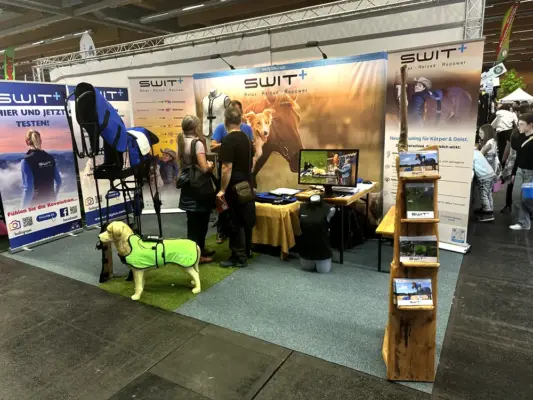 SWIT® exhibition booth featuring Neurobalance products for horses and dogs at the PFERD Wels 2025 fair in Austria.